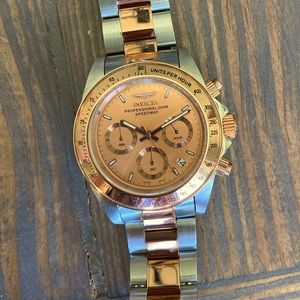 Women’s Invicta Rose gold and silver watch.